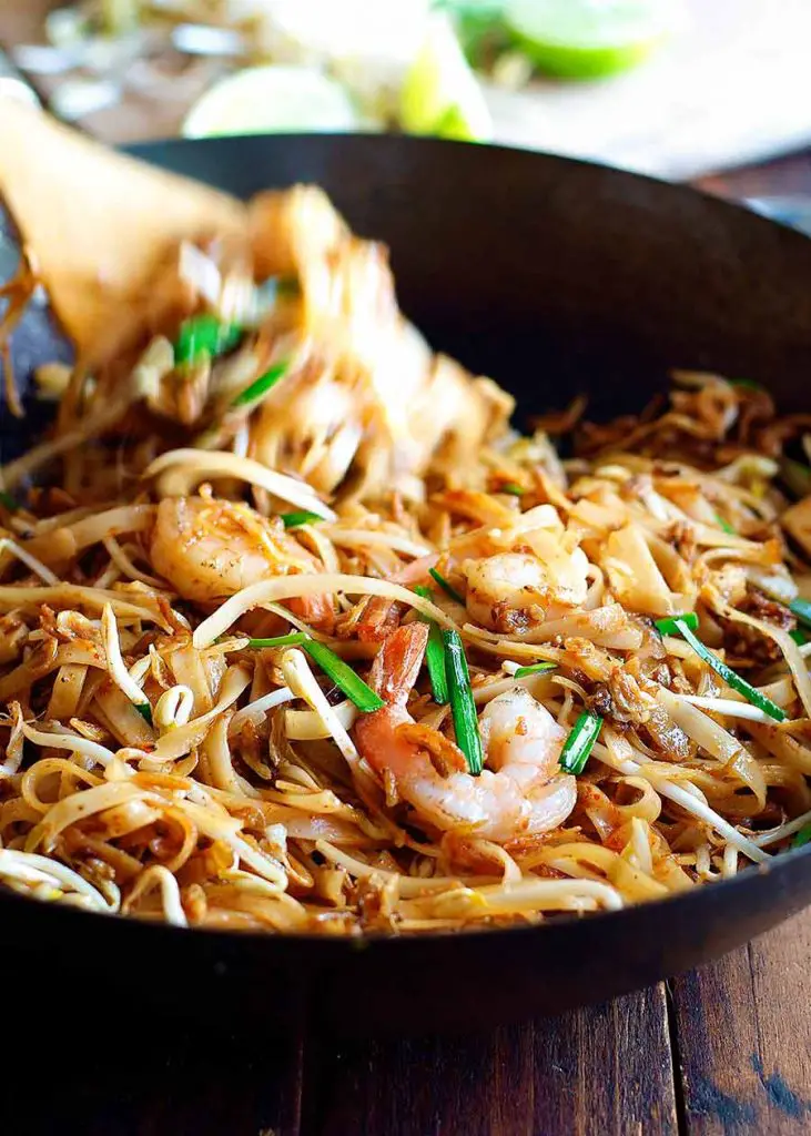 Tossing Shrimp Pad Thai in a wok